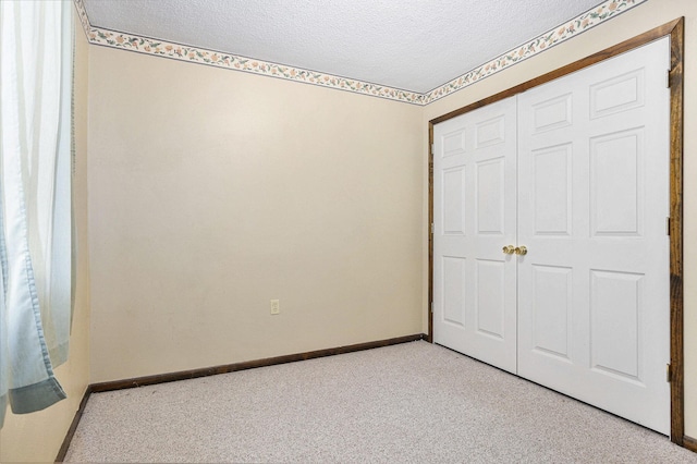 8257 S 2nd St, Michigan, MI 49071 - unfurnished bedroom with a textured ceiling, carpet flooring, and a closet