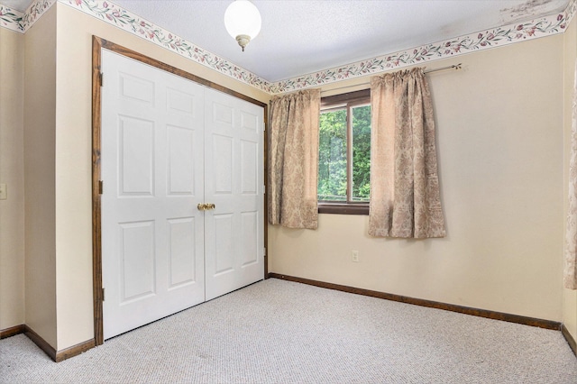 8257 S 2nd St, Michigan, MI 49071 - unfurnished bedroom with carpet flooring, a closet, and a textured ceiling