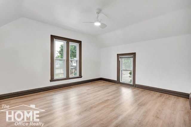 1114 Lynn St, Owosso, MI 48867 - additional living space with vaulted ceiling, a ceiling fan, wood finished floors, and healthy amount of natural light