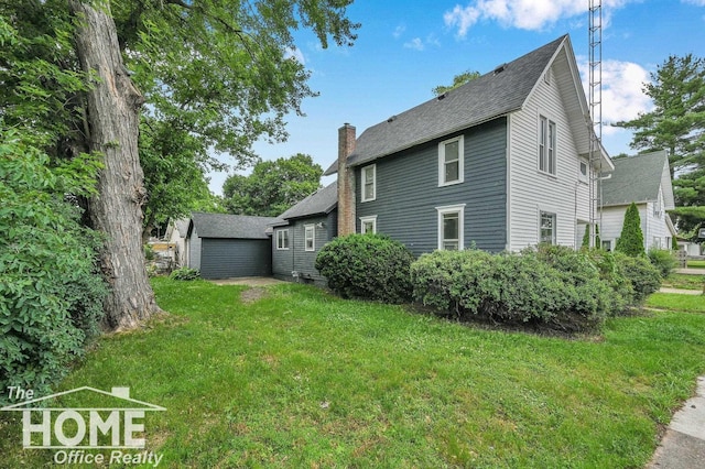 1114 Lynn St, Owosso, MI 48867 - view of side of property featuring a yard, a chimney, and roof with shingles