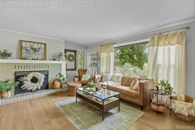 1300 N Livernois Rd, Rochester Hills, MI 48306 - living area featuring crown molding, wood finished floors, and a brick fireplace