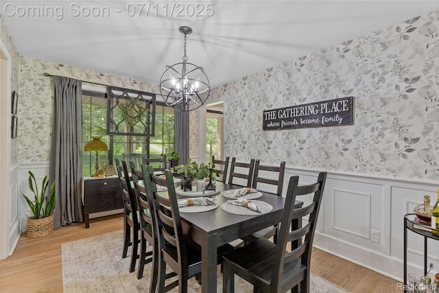 1300 N Livernois Rd, Rochester Hills, MI 48306 - dining space featuring wallpapered walls, a chandelier, wainscoting, healthy amount of natural light, and light wood-style flooring