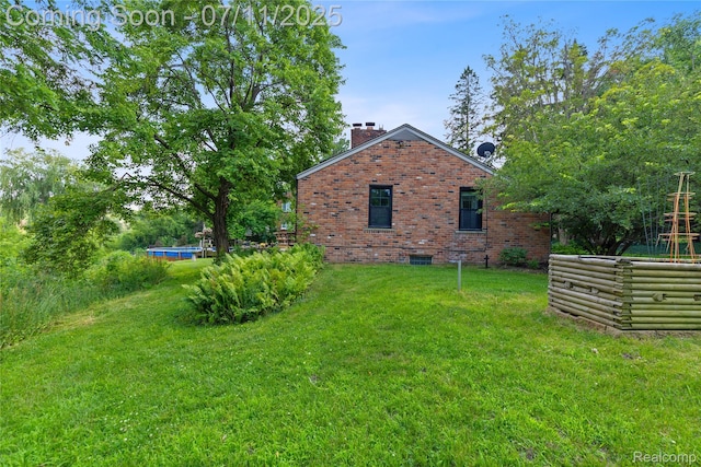 1300 N Livernois Rd, Rochester Hills, MI 48306 - view of side of home with a chimney, brick siding, and a lawn