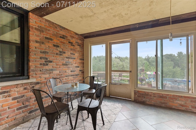 1300 N Livernois Rd, Rochester Hills, MI 48306 - sunroom / solarium featuring tile patterned floors, plenty of natural light, and brick wall