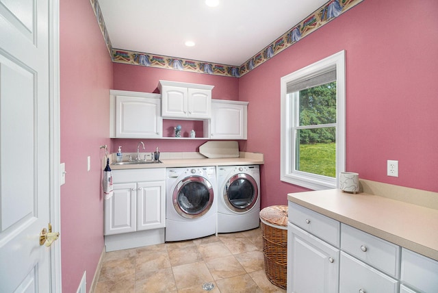 9991 Kaiser Rd, Saline, MI 48176 - laundry area featuring cabinet space, separate washer and dryer, and recessed lighting
