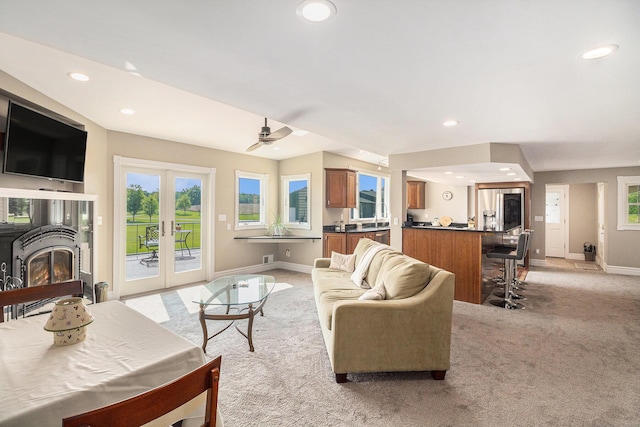9991 Kaiser Rd, Saline, MI 48176 - living area with light carpet, recessed lighting, french doors, plenty of natural light, and ceiling fan