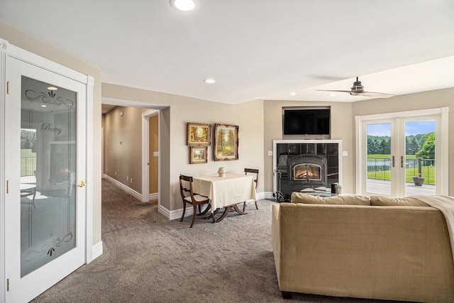 9991 Kaiser Rd, Saline, MI 48176 - living area with carpet flooring, french doors, recessed lighting, a ceiling fan, and a tile fireplace