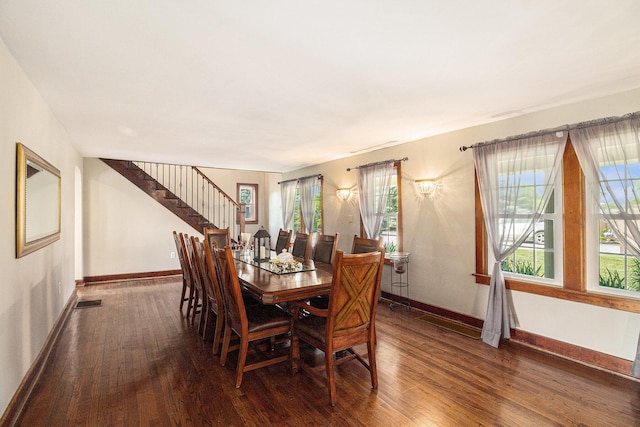 9991 Kaiser Rd, Saline, MI 48176 - dining area featuring hardwood / wood-style flooring and stairs