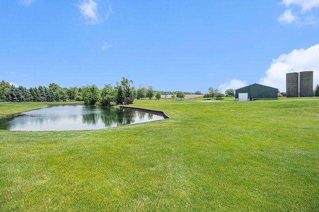 9991 Kaiser Rd, Saline, MI 48176 - view of green lawn with a detached garage and a water view