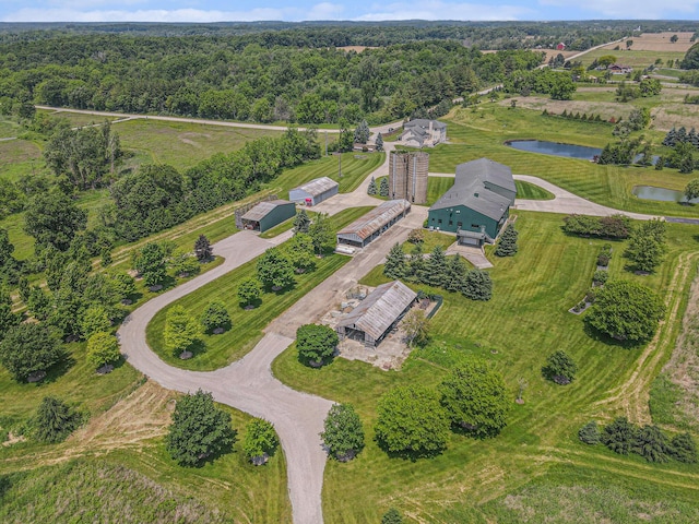 9991 Kaiser Rd, Saline, MI 48176 - aerial overview of property's location with a nearby body of water and a heavily wooded area