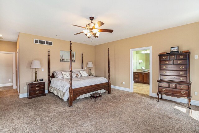 9991 Kaiser Rd, Saline, MI 48176 - bedroom with light carpet, a ceiling fan, and ensuite bath