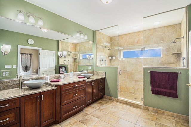 9991 Kaiser Rd, Saline, MI 48176 - full bath featuring double vanity, a shower stall, and tile patterned floors