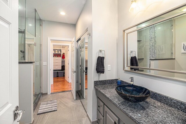 9991 Kaiser Rd, Saline, MI 48176 - full bathroom featuring a shower stall, vanity, recessed lighting, and a spacious closet