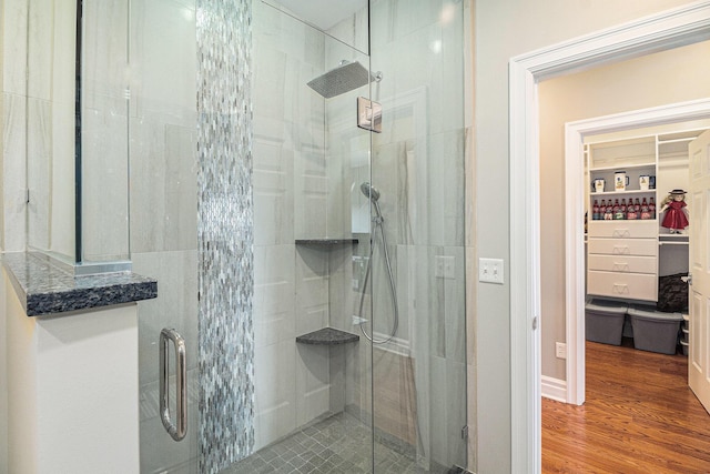 9991 Kaiser Rd, Saline, MI 48176 - full bathroom with a shower stall and wood finished floors