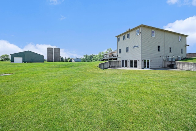 9991 Kaiser Rd, Saline, MI 48176 - rear view of property with a yard and a patio