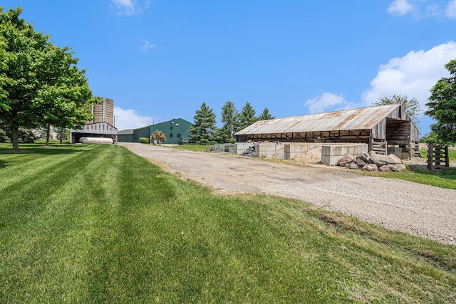 9991 Kaiser Rd, Saline, MI 48176 - view of dirt / gravel driveway featuring a pole building