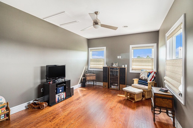 9991 Kaiser Rd, Saline, MI 48176 - living area featuring wine cooler, wood finished floors, and a ceiling fan