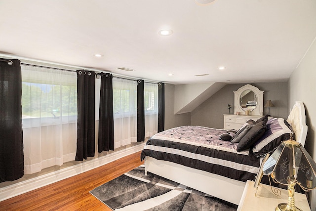 9991 Kaiser Rd, Saline, MI 48176 - bedroom with wood finished floors and recessed lighting