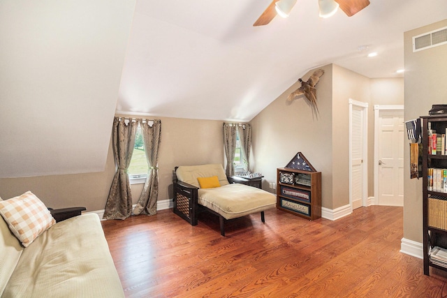 9991 Kaiser Rd, Saline, MI 48176 - living area with wood finished floors, a ceiling fan, and vaulted ceiling