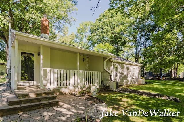 2338 Edgewood Dr, Kalamazoo, MI 49008 - back of property with a yard and a chimney