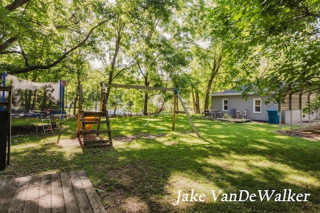 2338 Edgewood Dr, Kalamazoo, MI 49008 - fenced backyard featuring a trampoline and a playground