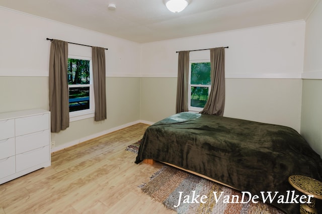 2338 Edgewood Dr, Kalamazoo, MI 49008 - bedroom with wood finished floors and crown molding