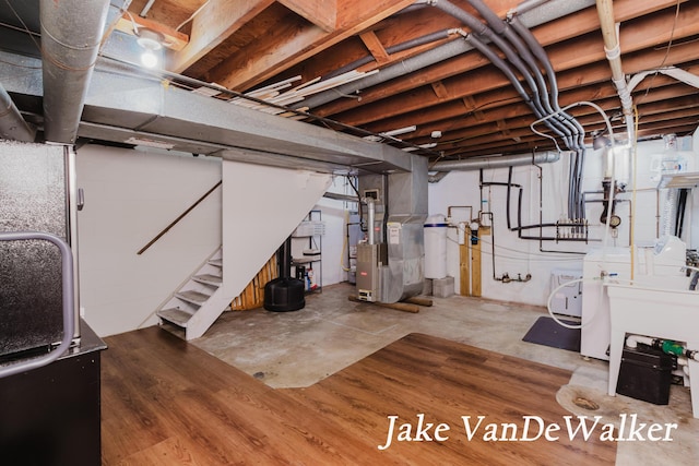 2338 Edgewood Dr, Kalamazoo, MI 49008 - unfinished below grade area with heating unit and stairway