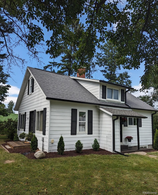 1295 S M 33, West Branch, MI 48661 - traditional home with a chimney, a front lawn, and roof with shingles