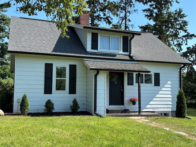 1295 S M 33, West Branch, MI 48661 - bungalow-style house featuring a chimney, a front yard, and a shingled roof