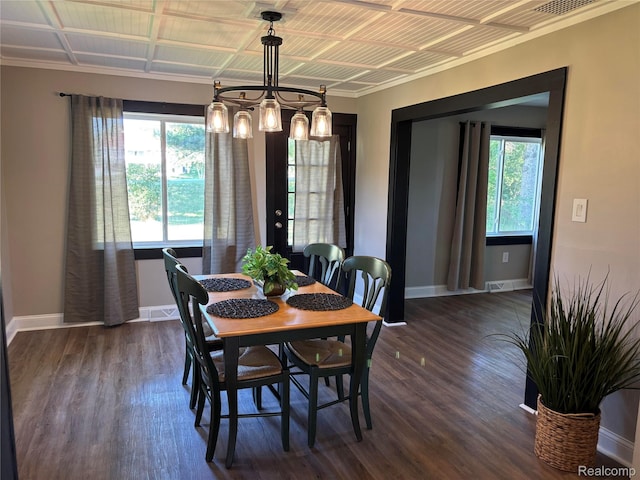 1295 S M 33, West Branch, MI 48661 - dining space with plenty of natural light, wood finished floors, and crown molding