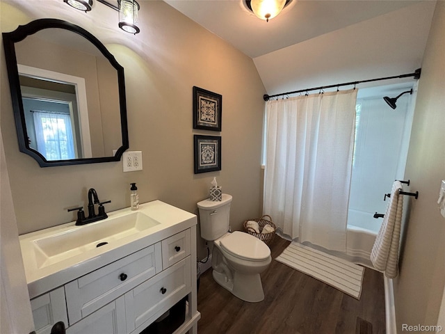 1295 S M 33, West Branch, MI 48661 - full bathroom with wood finished floors, vanity, shower / bathtub combination with curtain, and vaulted ceiling