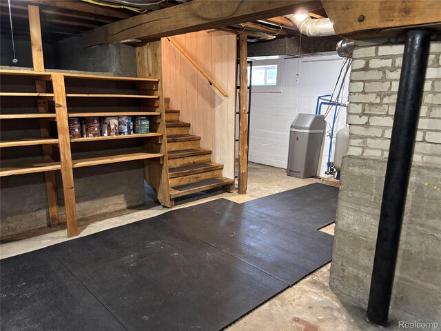 1295 S M 33, West Branch, MI 48661 - basement with a water softener, stairway, and a water pressure tank