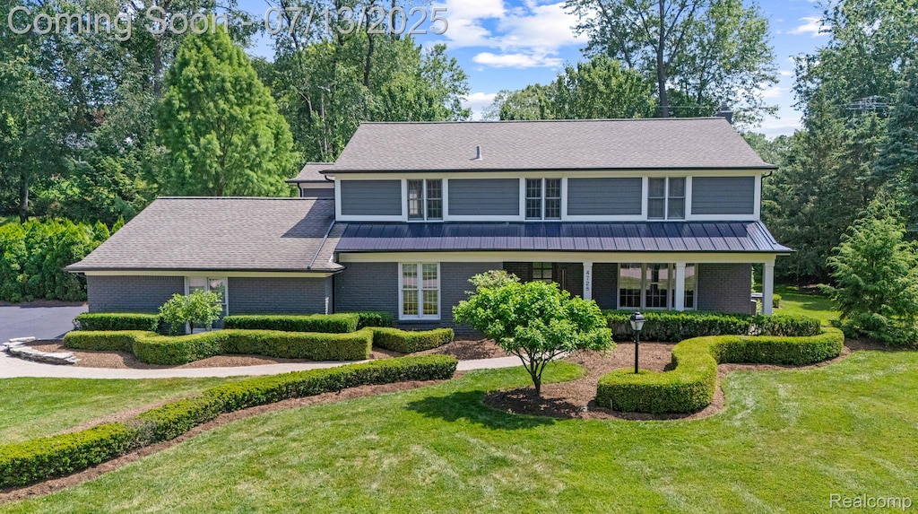 4728 Brafferton Dr, Bloomfield Hills, MI 48302 - traditional home featuring a front yard and brick siding