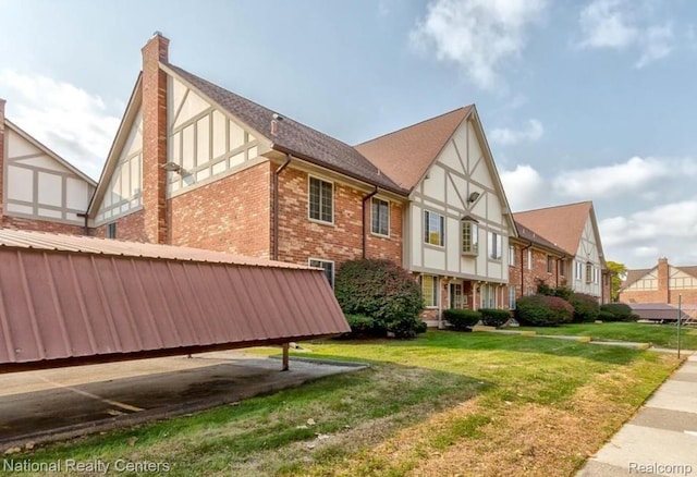 30260 Southfield Rd, Southfield, MI 48076 - view of side of home featuring brick siding, a lawn, and a chimney