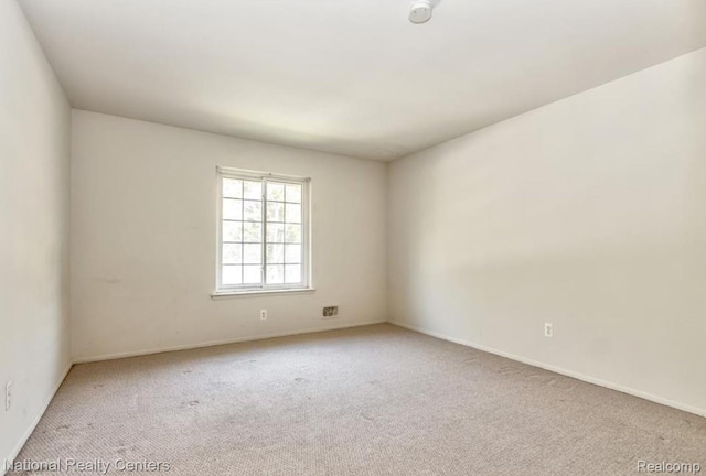 30260 Southfield Rd, Southfield, MI 48076 - spare room with carpet flooring and a smoke detector
