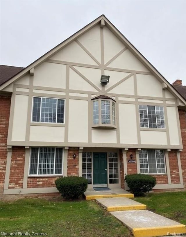 30260 Southfield Rd, Southfield, MI 48076 - english style home with brick siding, stucco siding, and a front lawn