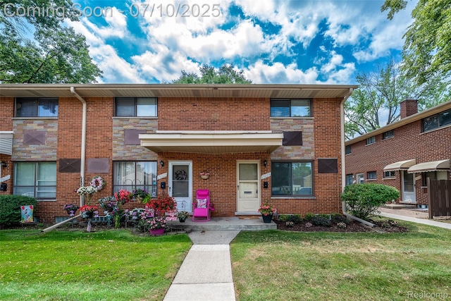 29225 Tessmer Ct, Madison Heights, MI 48071 - view of property with a front lawn, brick siding, and stone siding