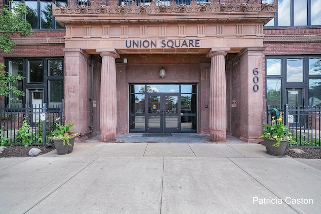 600 Broadway Ave NW Unit 124, Grand Rapids, MI 49504 - view of exterior entry featuring french doors