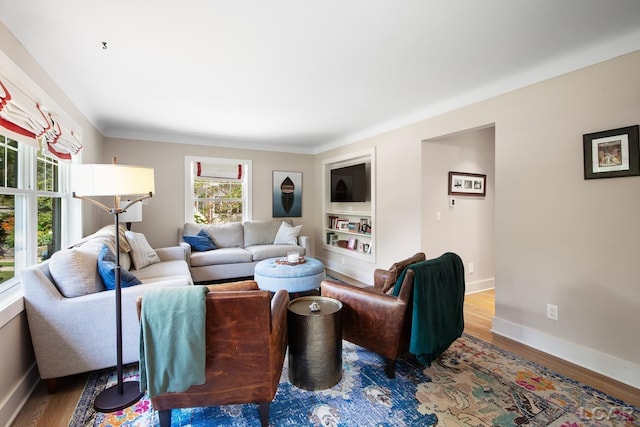 144 N Scott St, Adrian, MI 49221 - living room featuring wood finished floors and baseboards
