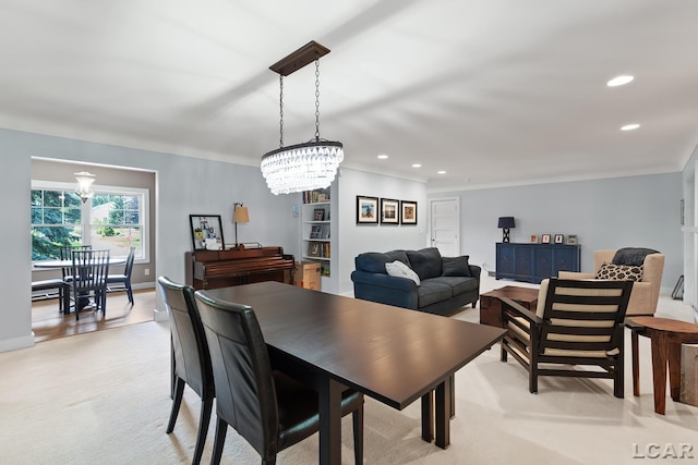 144 N Scott St, Adrian, MI 49221 - dining space with recessed lighting, a chandelier, and light colored carpet