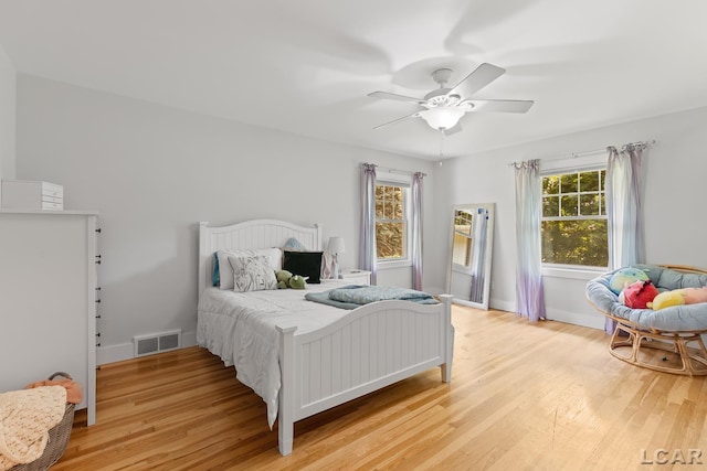 144 N Scott St, Adrian, MI 49221 - bedroom featuring light wood-style floors and ceiling fan