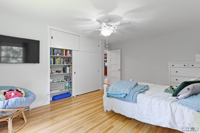 144 N Scott St, Adrian, MI 49221 - bedroom with wood finished floors, ceiling fan, and a closet