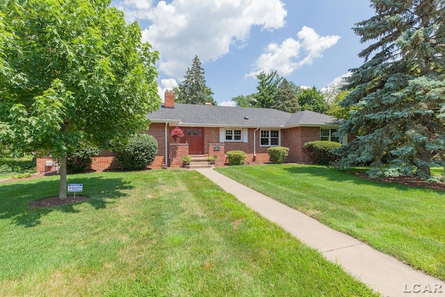 144 N Scott St, Adrian, MI 49221 - ranch-style house featuring brick siding, a front lawn, and a chimney