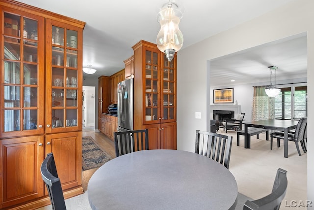 144 N Scott St, Adrian, MI 49221 - dining space featuring a fireplace