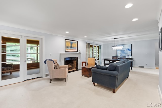 144 N Scott St, Adrian, MI 49221 - living room featuring light colored carpet, recessed lighting, and a high end fireplace