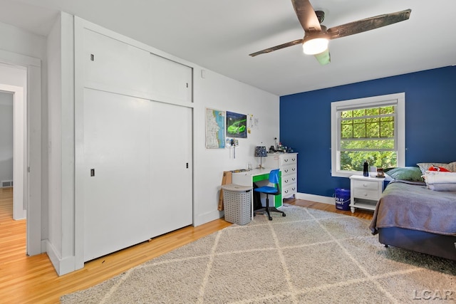 144 N Scott St, Adrian, MI 49221 - bedroom with wood finished floors, a closet, and ceiling fan