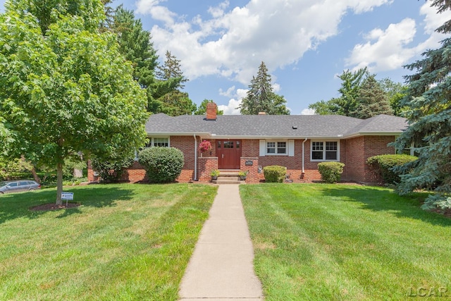 144 N Scott St, Adrian, MI 49221 - ranch-style house with brick siding, a front yard, and a chimney