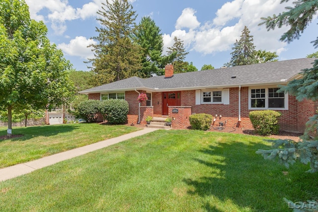 144 N Scott St, Adrian, MI 49221 - single story home with brick siding, a chimney, and a front yard