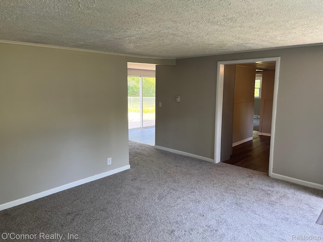 5035 Burma Rd, Kimball, MI 48074 - carpeted empty room featuring a textured ceiling and baseboards