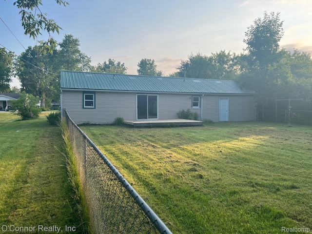 5035 Burma Rd, Kimball, MI 48074 - rear view of house featuring a fenced backyard and a metal roof